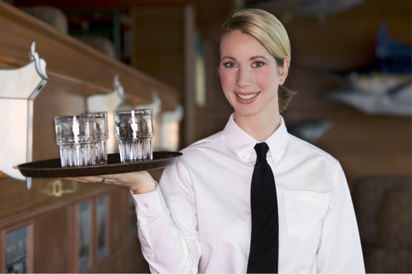 Woman server smiling.