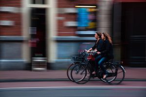 Two women riding bicycles