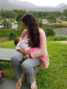 Woman breastfeeding infant