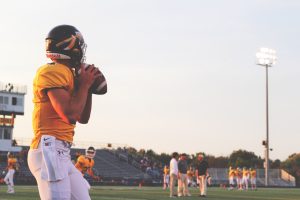 Teenager playing American Football