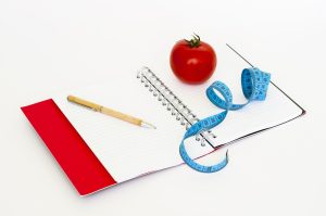 Measuring Tape, apple, notebook