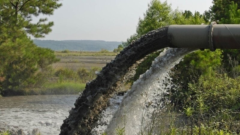 Photo of discharge of industrial waste into river